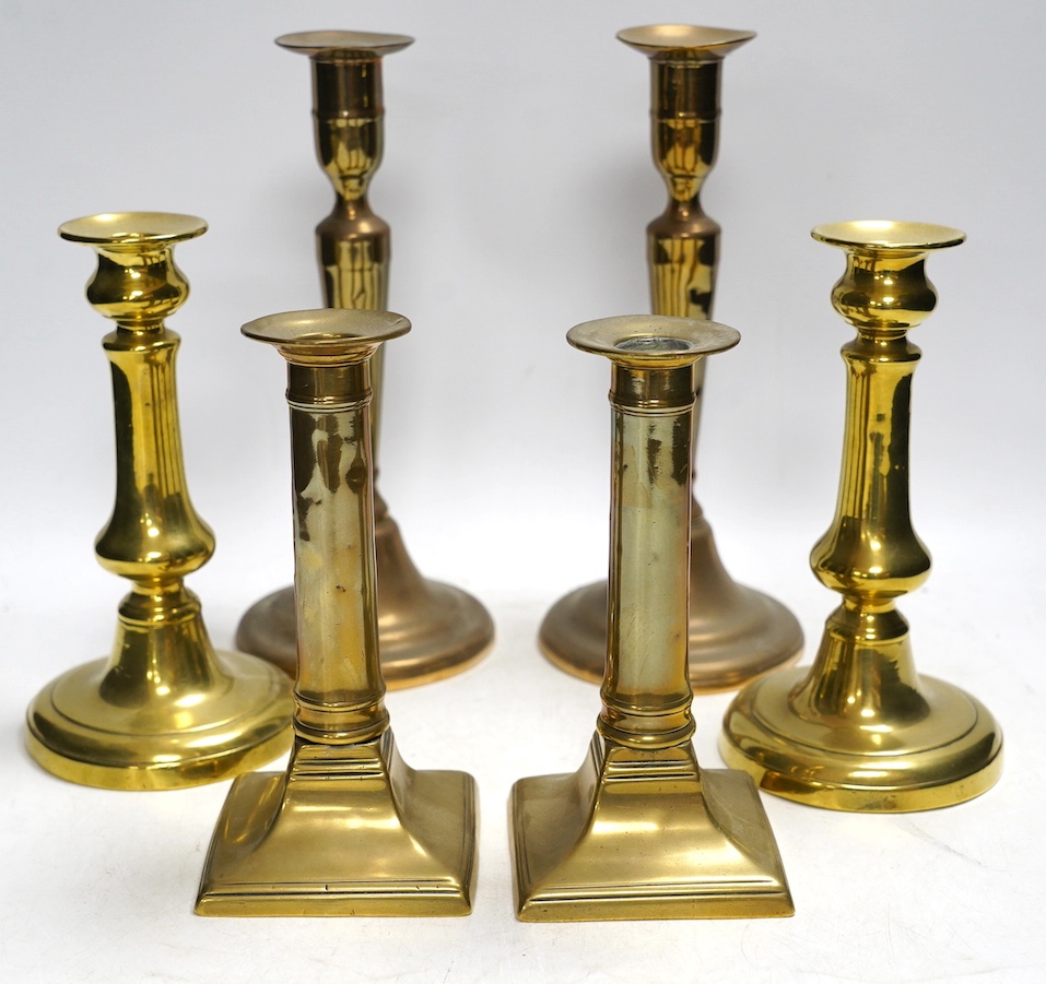 Three pairs of brass candlesticks, tallest 24cm. Condition - fair to good